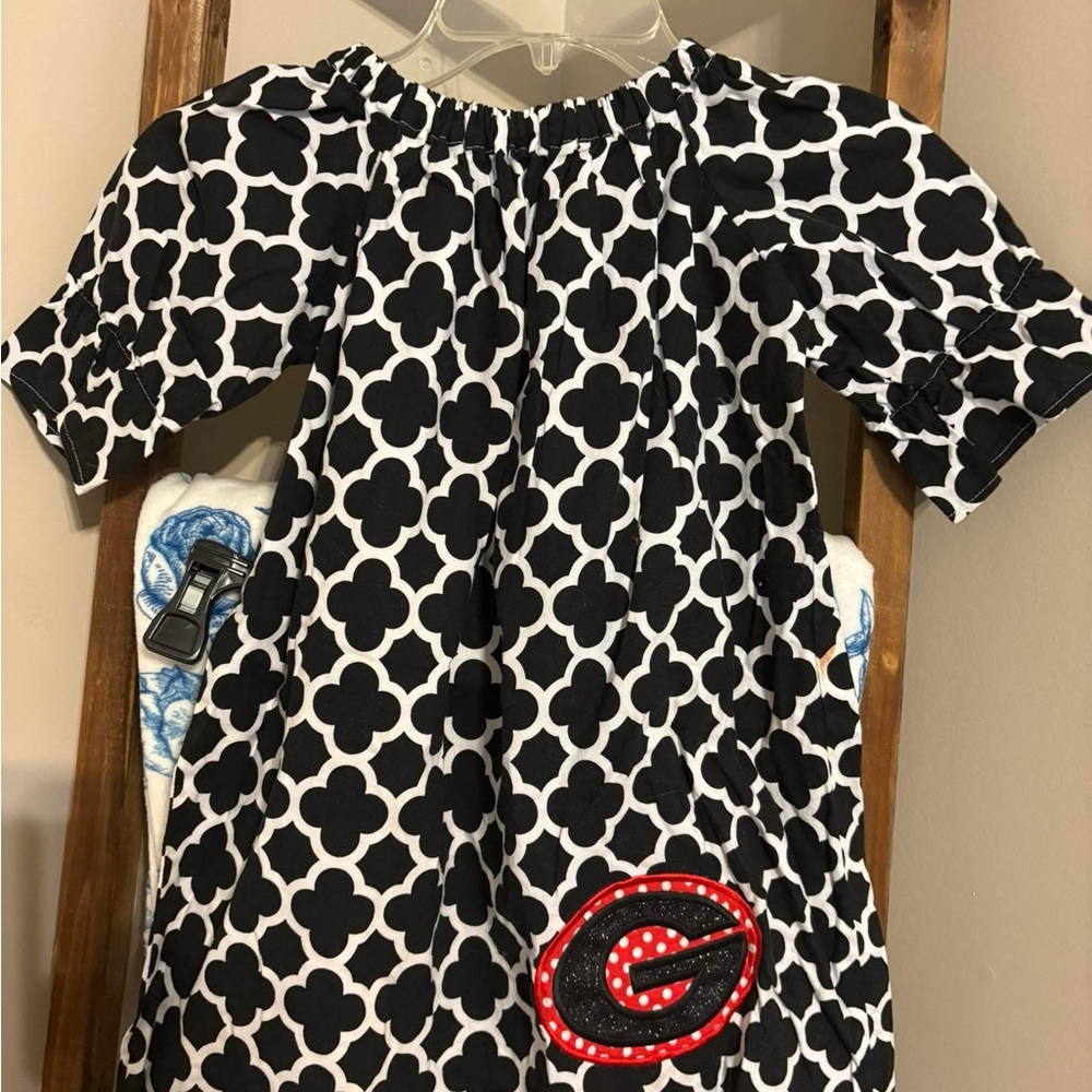 Black and White Patterned Dress with Red Accent